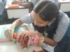 student making nepalese womam